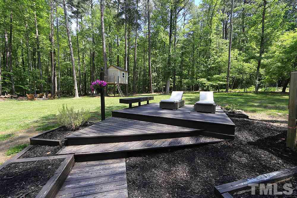 716 Bennington Drive Raleigh, NC 27615 - Photo 20 of 29 a view of a park with large trees