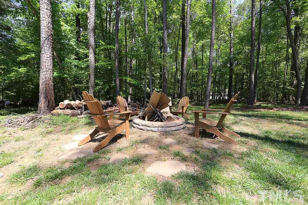 716 Bennington Drive Raleigh, NC 27615 - Photo 22 of 29 a view of a park with swings and slides