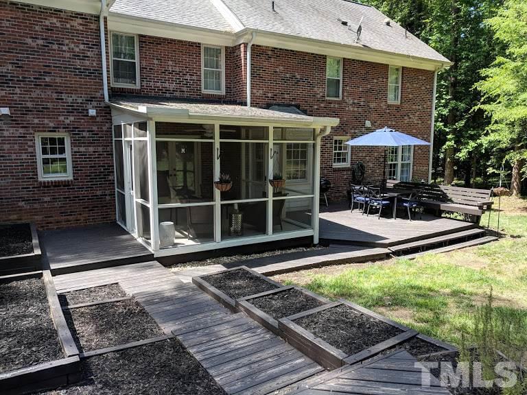 716 Bennington Drive Raleigh, NC 27615 - Photo 23 of 29 a view of a house with backyard porch and sitting area