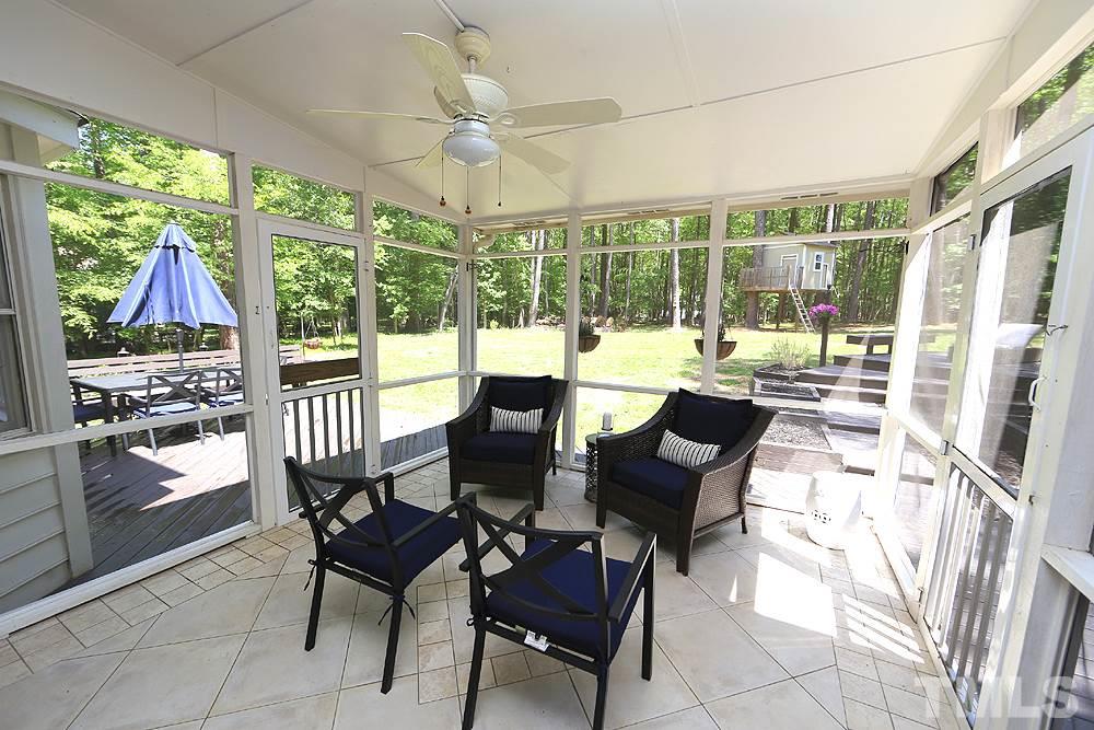 716 Bennington Drive Raleigh, NC 27615 - Photo 24 of 29 a view of a dining room with furniture large windows and wooden floor