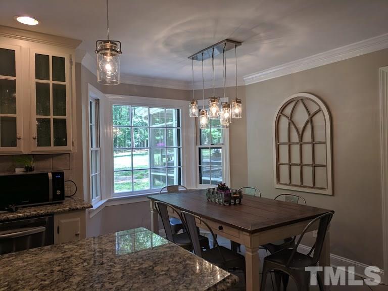 716 Bennington Drive Raleigh, NC 27615 - Photo 5 of 29 a view of a livingroom with furniture window and wooden floor