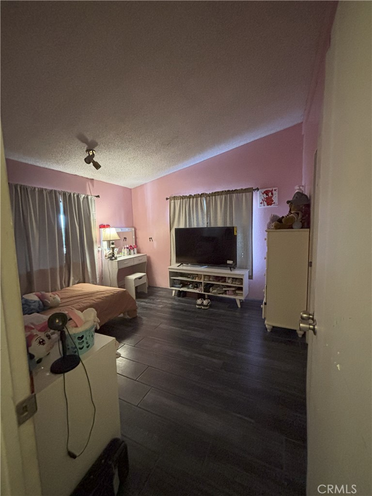 4080 Pedley Road, Unit 2 Jurupa Valley, CA 92509 - Photo 12 of 21 a living room with furniture and a flat screen tv