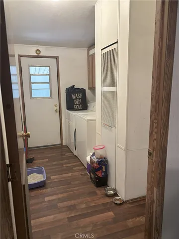 a view of a livingroom with furniture and wooden floor