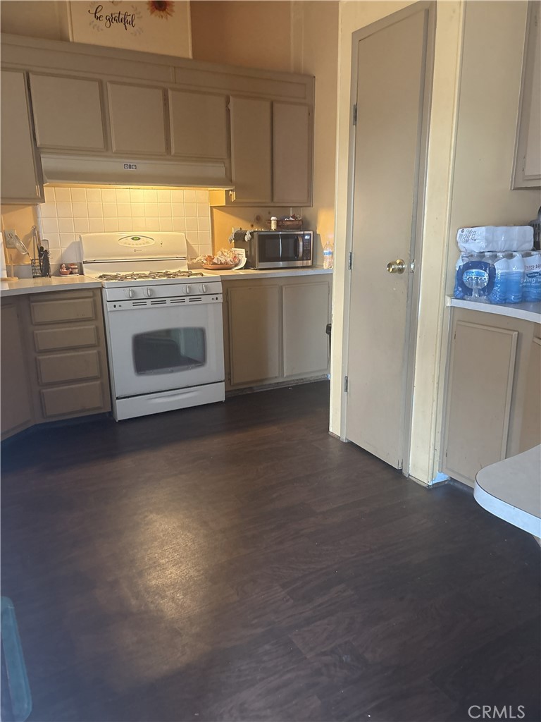 4080 Pedley Road, Unit 2 Jurupa Valley, CA 92509 - Photo 19 of 21 a kitchen with stainless steel appliances granite countertop a stove a sink and a refrigerator