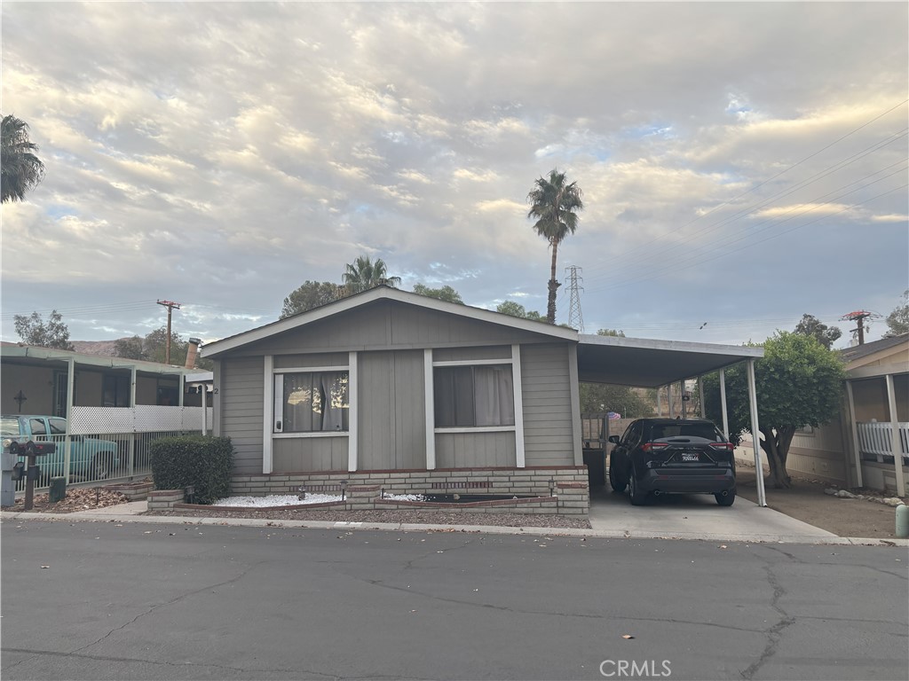 4080 Pedley Road, Unit 2 Jurupa Valley, CA 92509 - Photo 2 of 21 a front view of a house with a yard