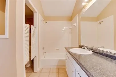 a white toilet sitting next to a shower curtain