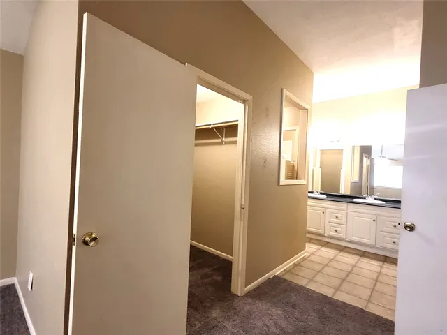 a kitchen with stainless steel appliances granite countertop a stove top oven a sink dishwasher and a refrigerator