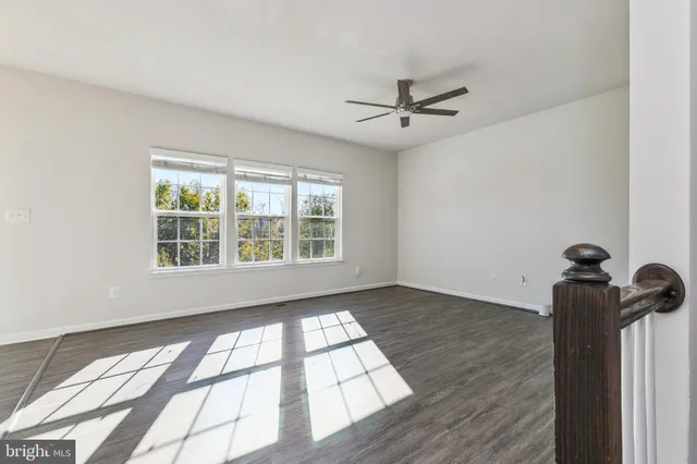 a view of an empty room and a window