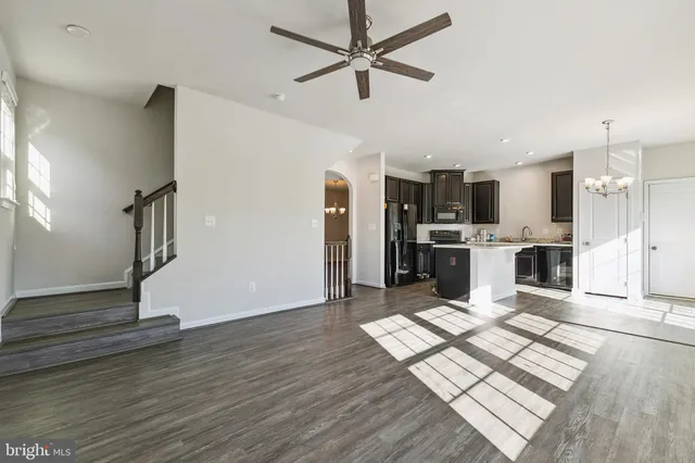a view of kitchen with cabinets and wooden floor