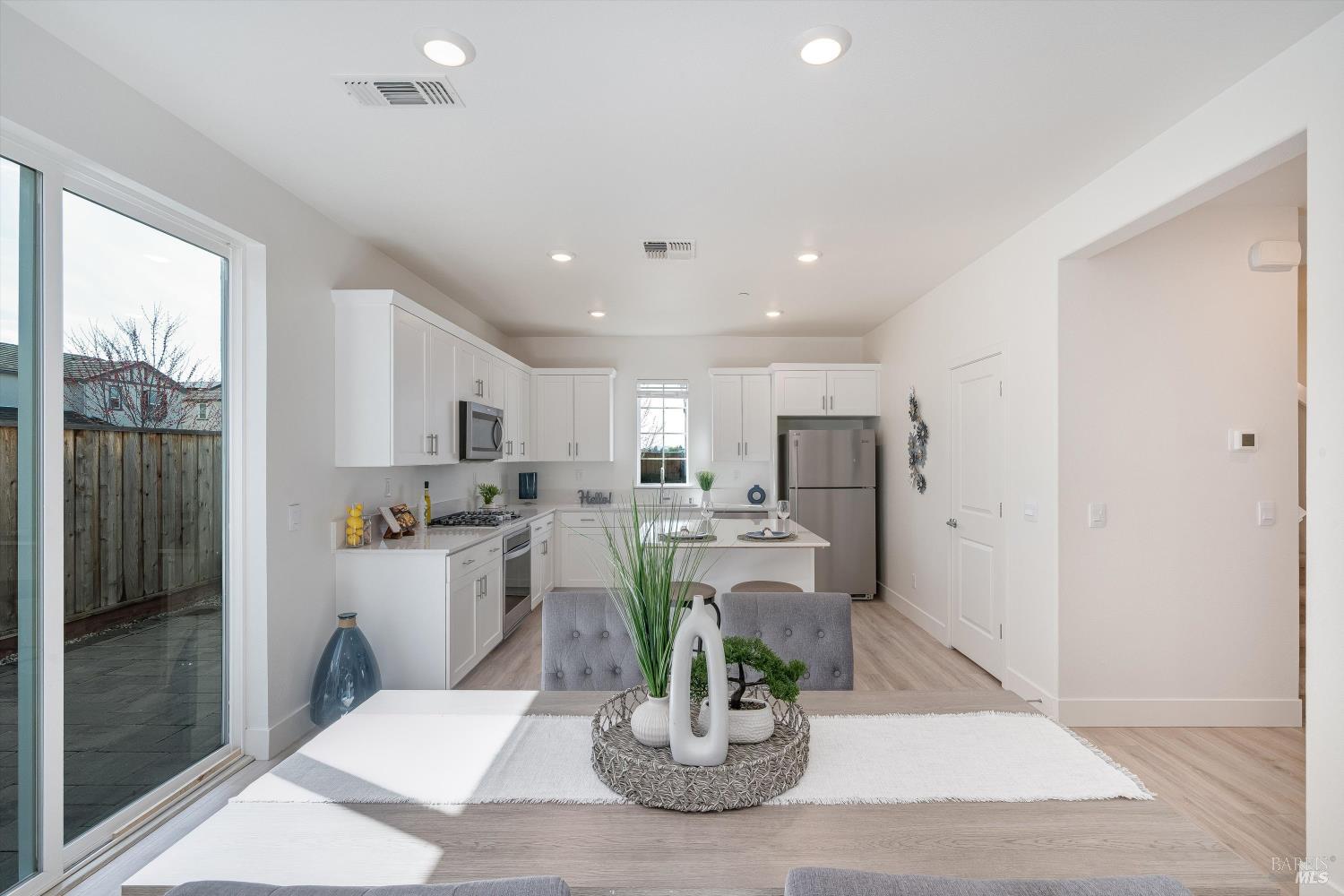 6054 Oxford Place Rohnert Park, CA 94928 - Photo 12 of 44 a kitchen with stainless steel appliances a refrigerator and a counter top space