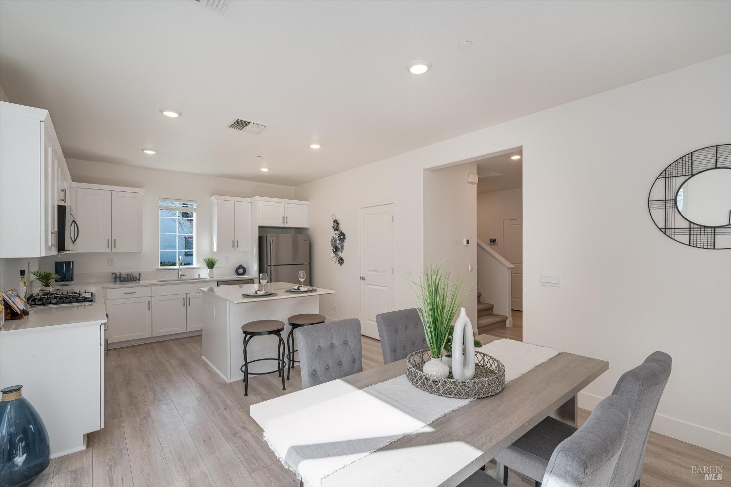 6054 Oxford Place Rohnert Park, CA 94928 - Photo 13 of 44 a kitchen with a table and chairs in it