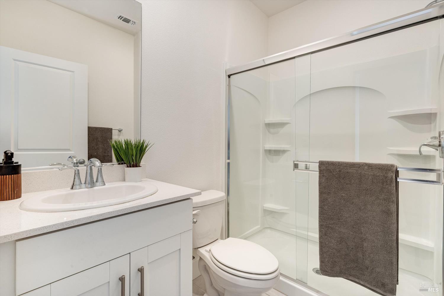 6054 Oxford Place Rohnert Park, CA 94928 - Photo 20 of 44 a bathroom with a sink a toilet and shower