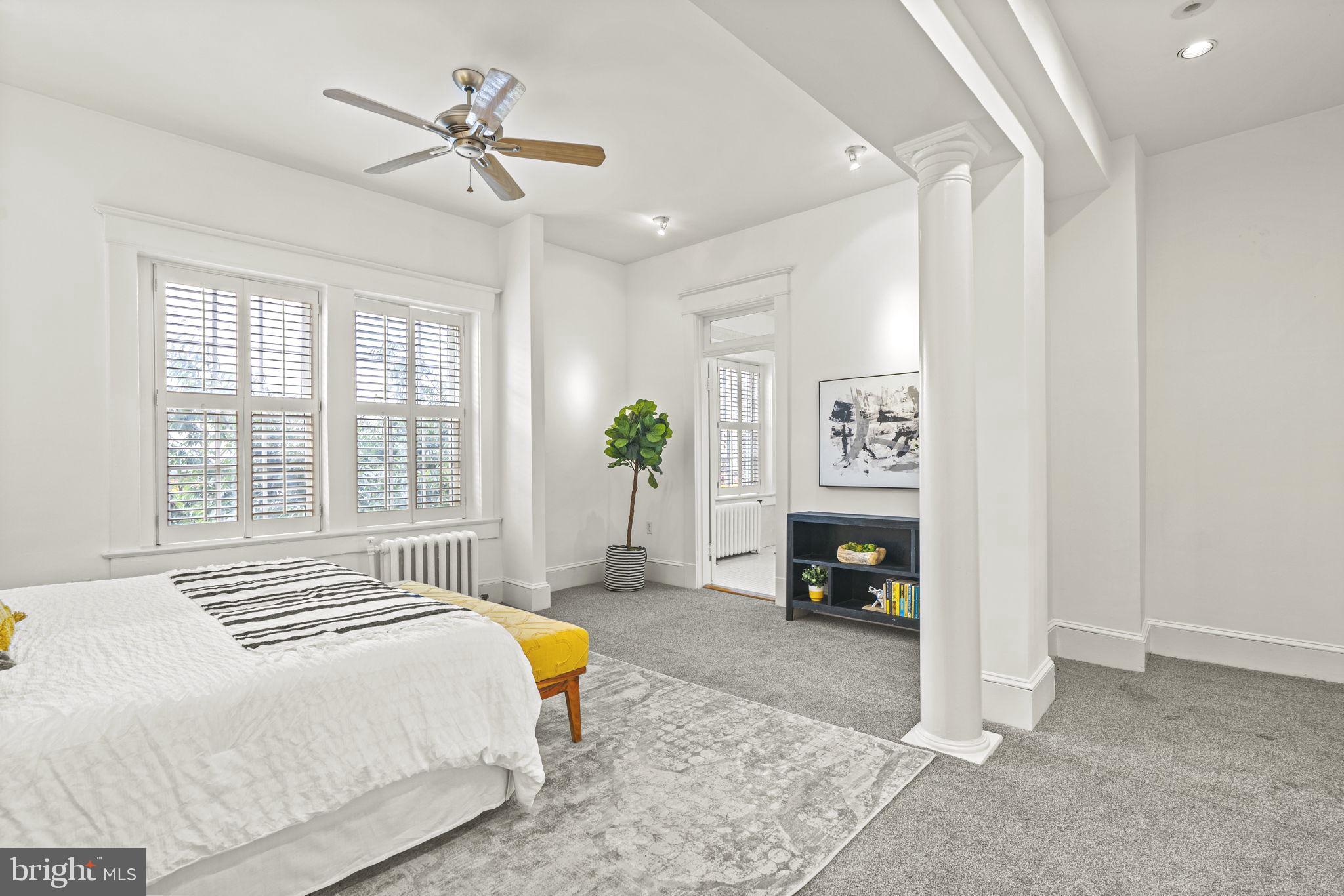 1736 Columbia Road Northwest, Unit 102 Washington, DC 20009 - Photo 16 of 39 a bedroom with a bed dresser and a window