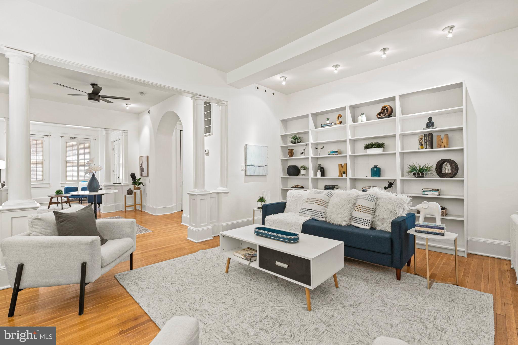 1736 Columbia Road Northwest, Unit 102 Washington, DC 20009 - Photo 2 of 39 a living room with furniture cabinets and wooden floor