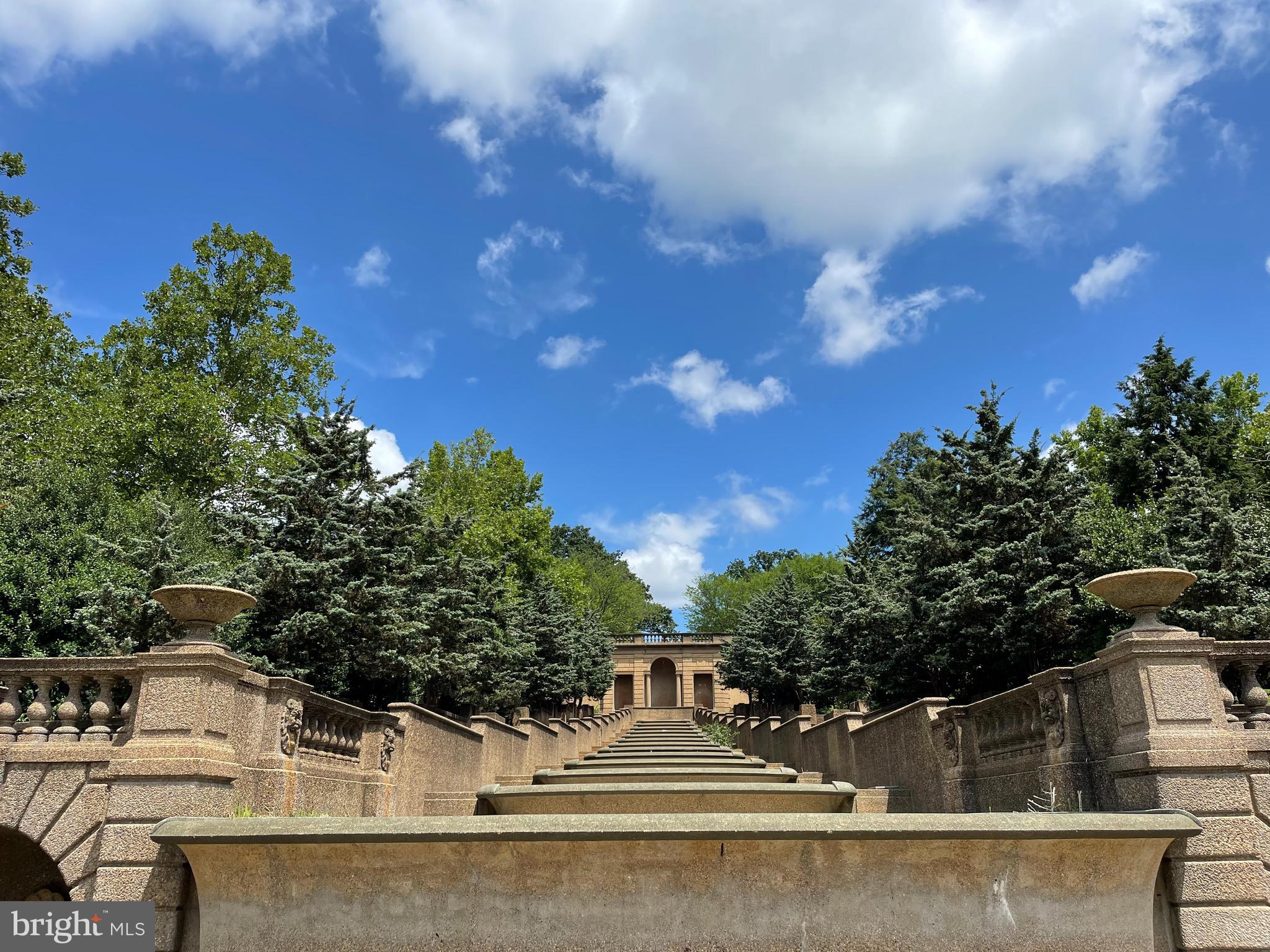 1736 Columbia Road Northwest, Unit 102 Washington, DC 20009 - Photo 37 of 39 a view of a white house with a tree in the background