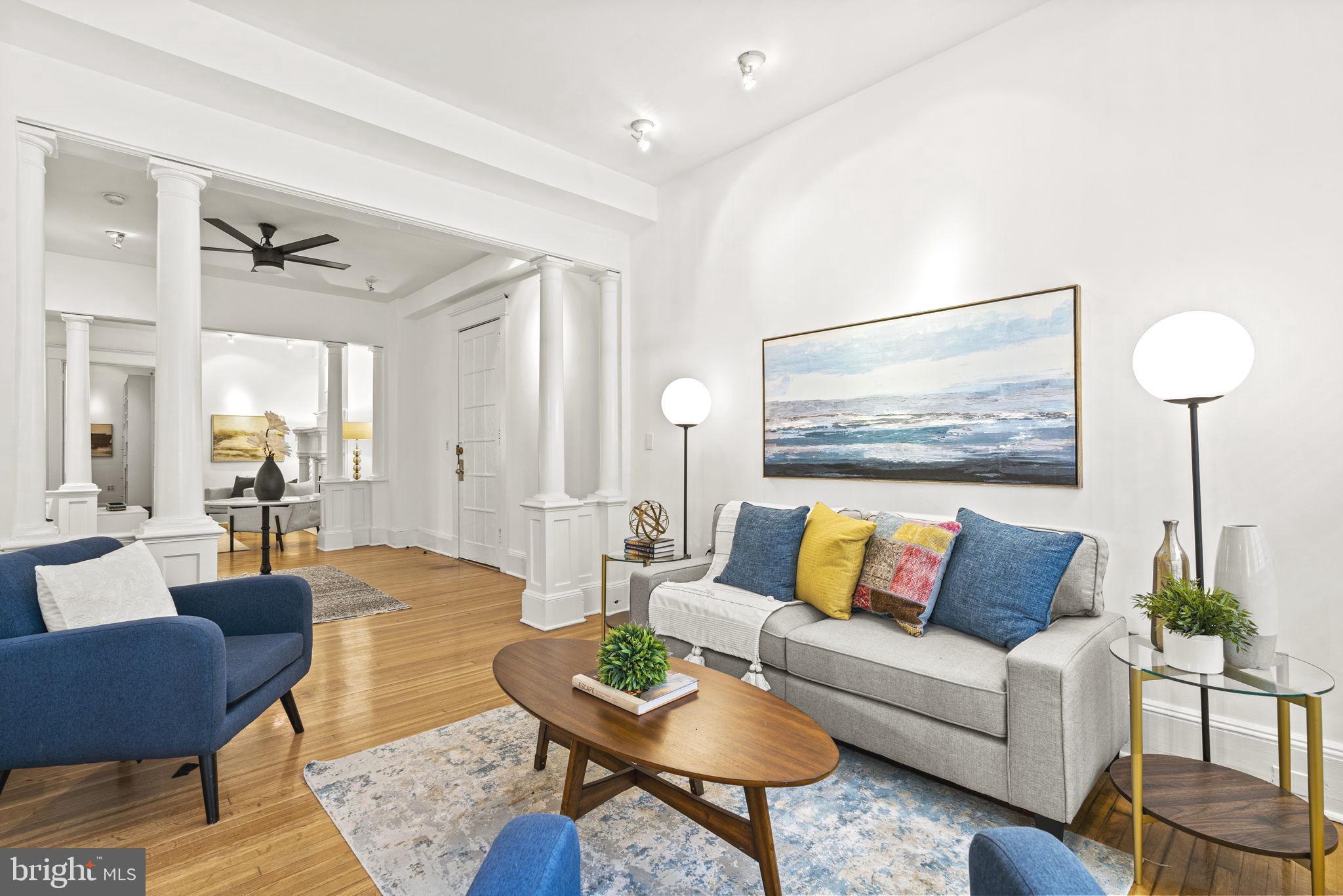 1736 Columbia Road Northwest, Unit 102 Washington, DC 20009 - Photo 5 of 39 a living room with furniture and wooden floor