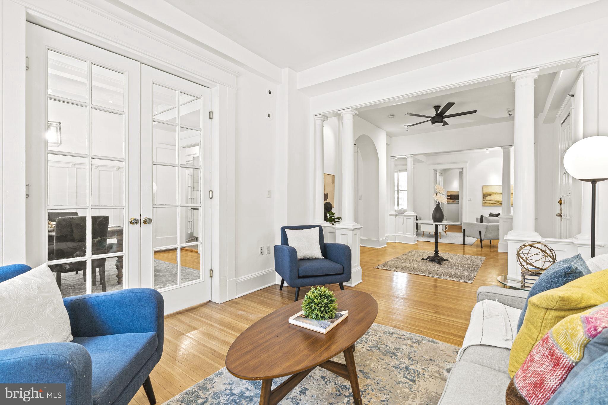 1736 Columbia Road Northwest, Unit 102 Washington, DC 20009 - Photo 6 of 39 a living room with furniture and a window