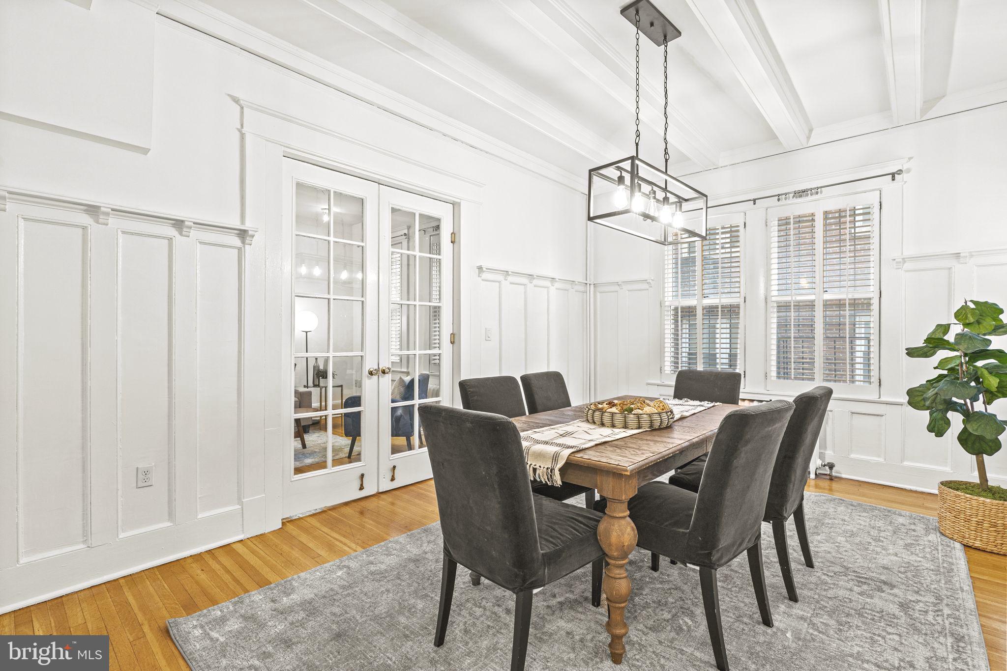 1736 Columbia Road Northwest, Unit 102 Washington, DC 20009 - Photo 8 of 39 a view of a dining room with furniture window and wooden floor