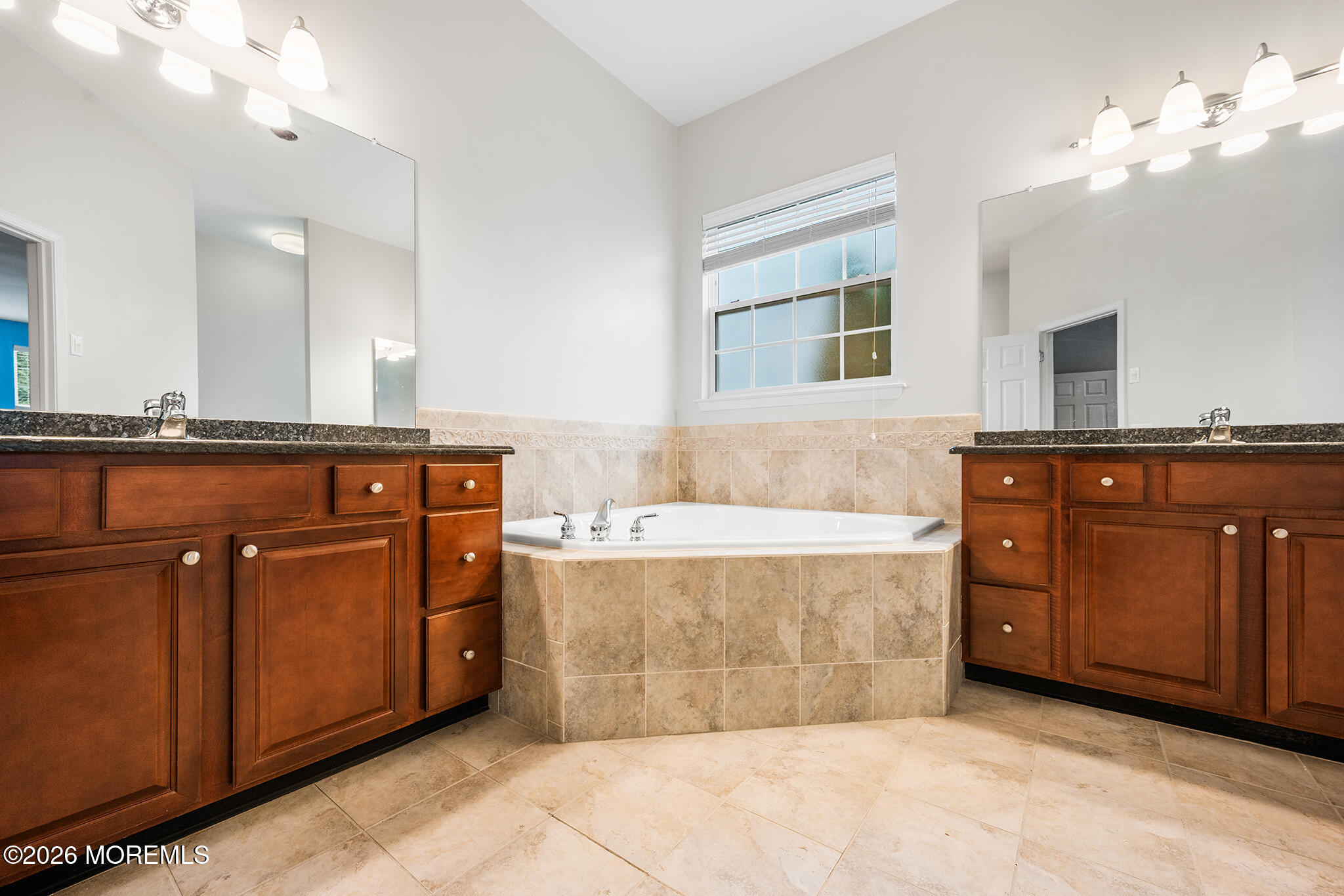 7 Brattleboro Road Jackson, NJ 08527 - Photo 21 of 62 a spacious bathroom with a tub sink and mirror