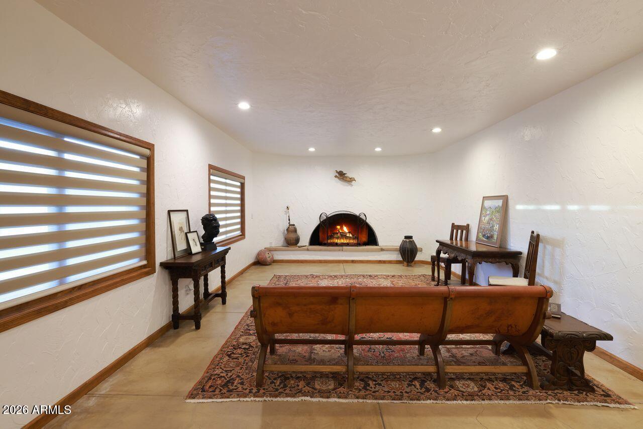 8741 East Woodland Road Tucson, AZ 85749 - Photo 13 of 51 a living room with furniture and a piano