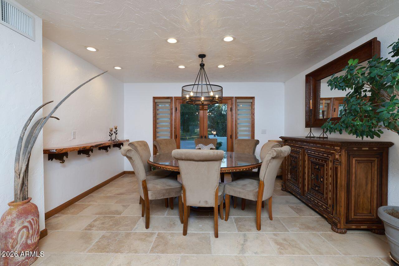 8741 East Woodland Road Tucson, AZ 85749 - Photo 14 of 51 a dining room with furniture and window