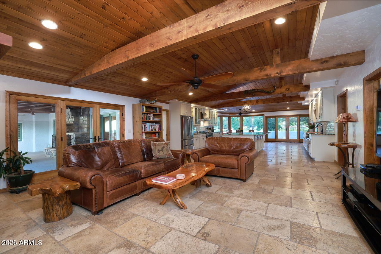 8741 East Woodland Road Tucson, AZ 85749 - Photo 15 of 51 a outdoor living space with furniture and a fireplace