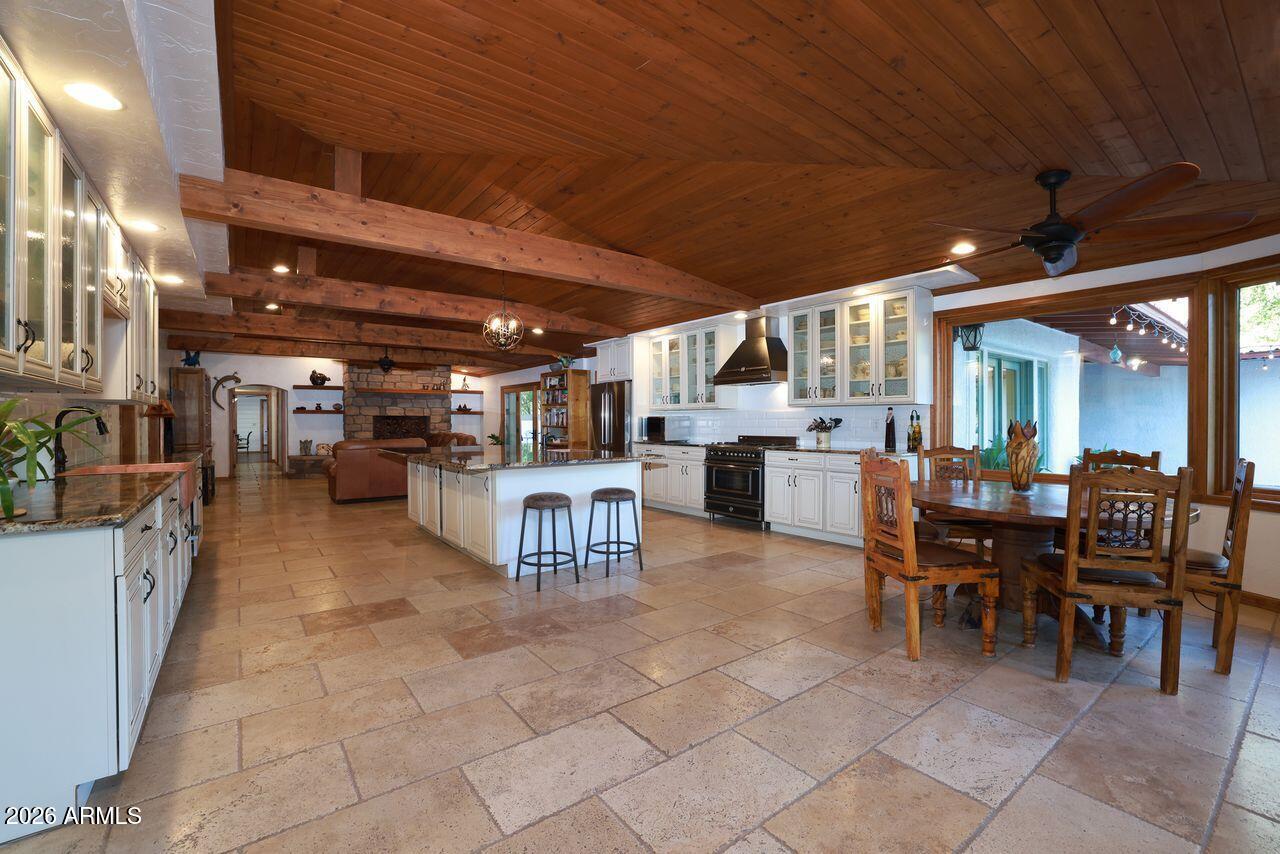 8741 East Woodland Road Tucson, AZ 85749 - Photo 18 of 51 a view of a dining space with furniture and chandelier