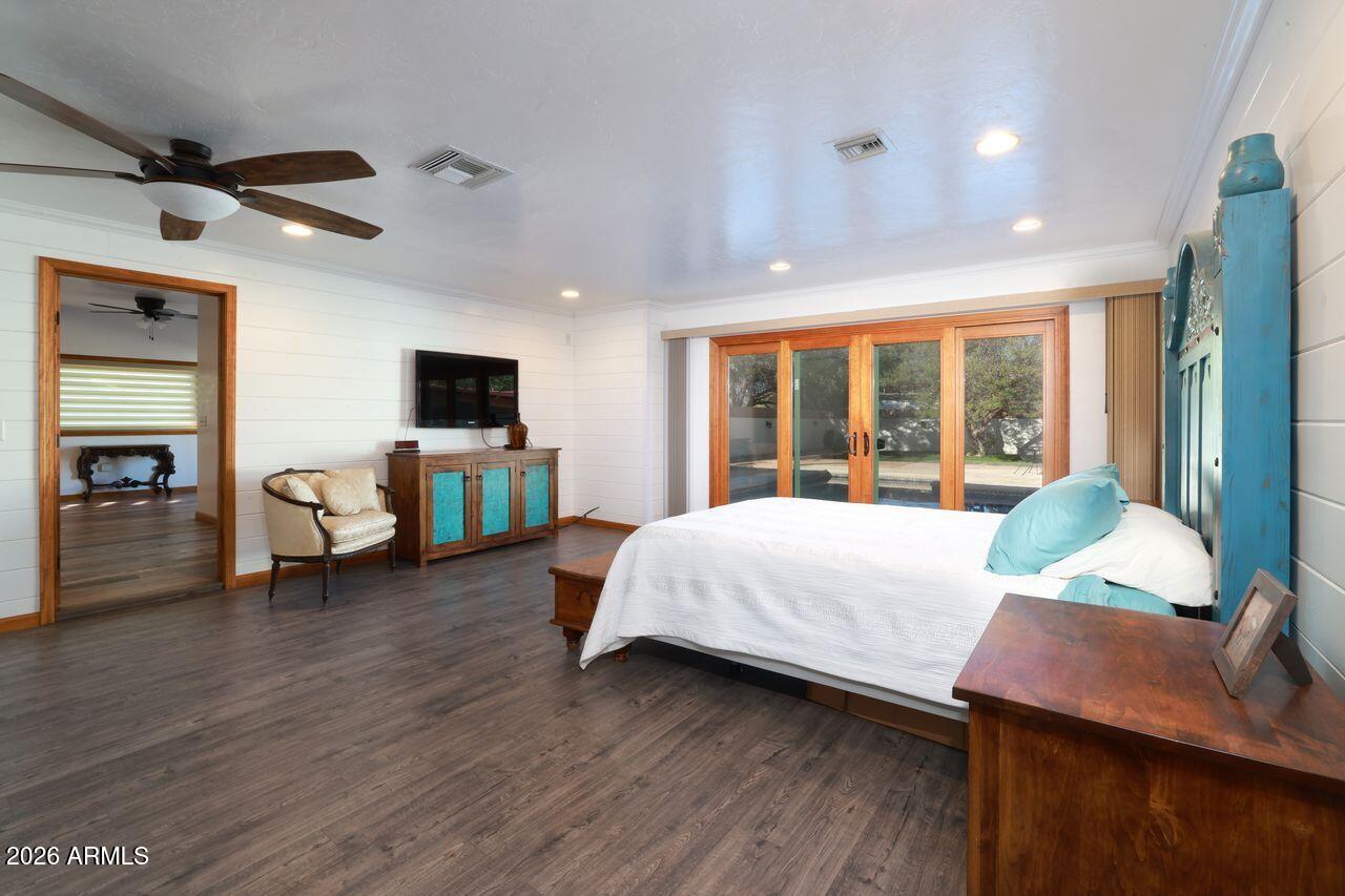 8741 East Woodland Road Tucson, AZ 85749 - Photo 21 of 51 a bed room with a bed and tv