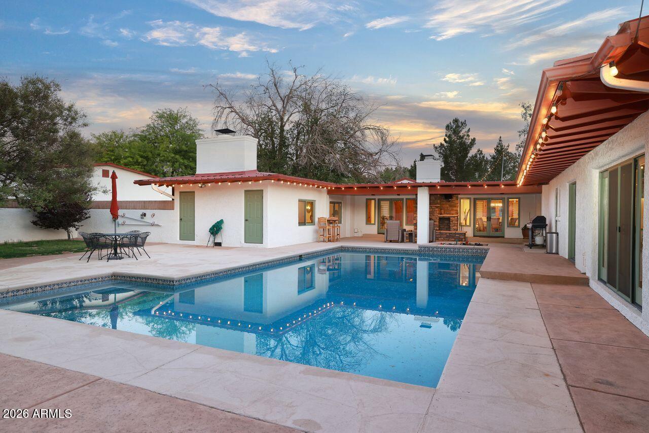 8741 East Woodland Road Tucson, AZ 85749 - Photo 41 of 51 a view of a house with backyard and sitting area