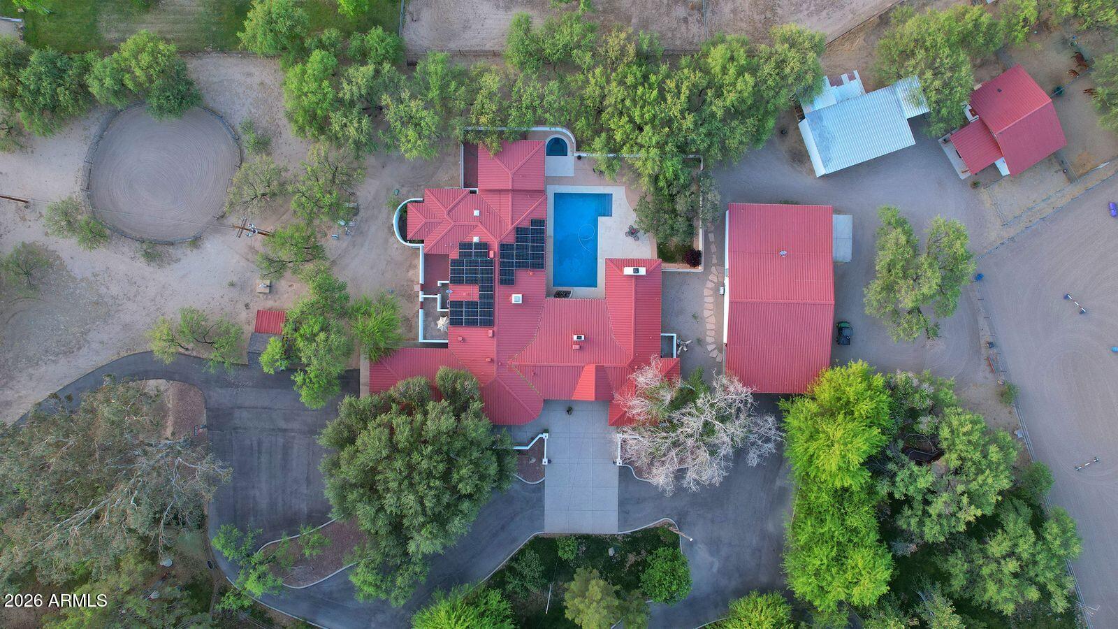 8741 East Woodland Road Tucson, AZ 85749 - Photo 5 of 51 an aerial view of a house with pool garden and outdoor seating
