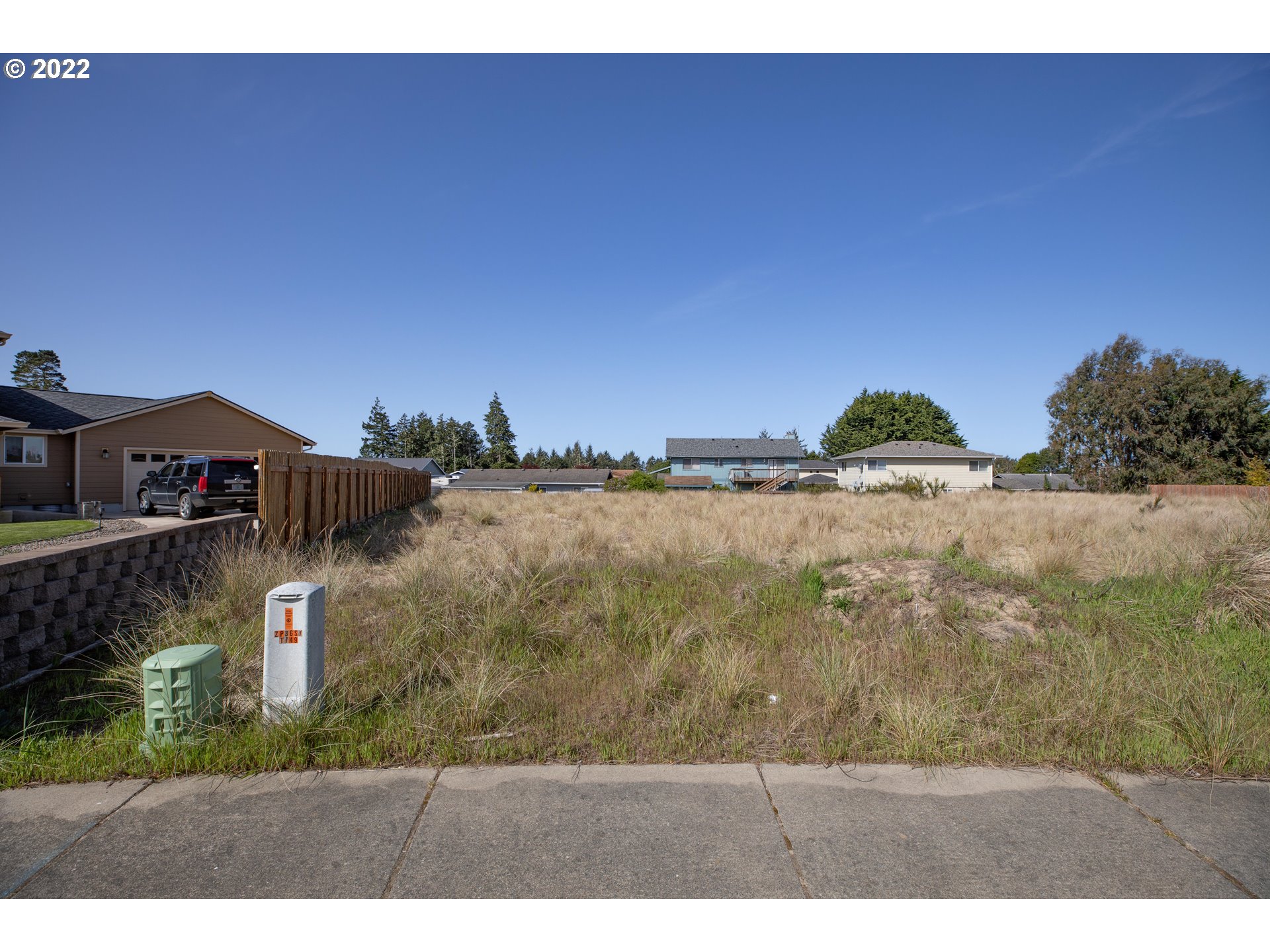 2040 Roosevelt Loop North Bend, OR 97459 - Photo 20 of 22 a aerial view of a yard with an outdoor space and seating