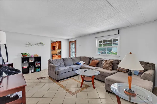 a living room with furniture and a window