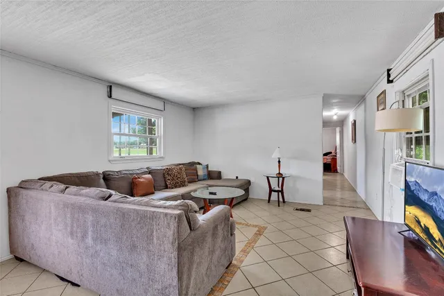 a living room with furniture and a table