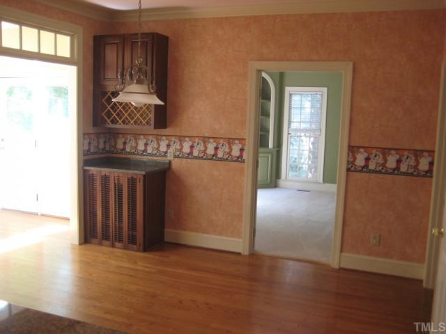 8308 Harps Mill Road Raleigh, NC 27615 - Photo 5 of 12 View of the breakfast room from the kitchen. The sunroom is off to the left. Note the adorable built-in in the corner. Breakfast Area