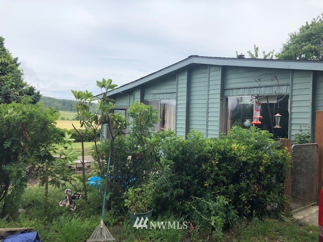 1133 Center Road Chimacum, WA 98325 - Photo 1 of 1 a front view of a house with a yard