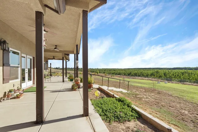 a view of a patio with swimming pool