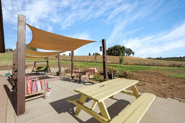a view of a lake with houses in the back