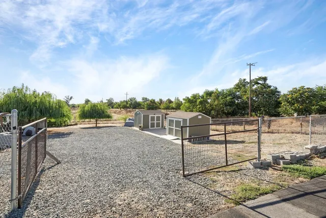 a view of a road with a building in the background