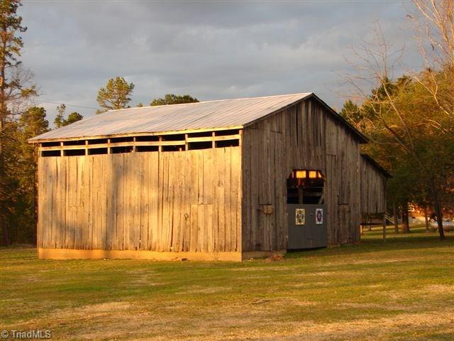 4904 Reeder Road Asheboro, NC 27205 - Photo 14 of 30 4 stall Barn with extra storage(block foundation)and side shelter.