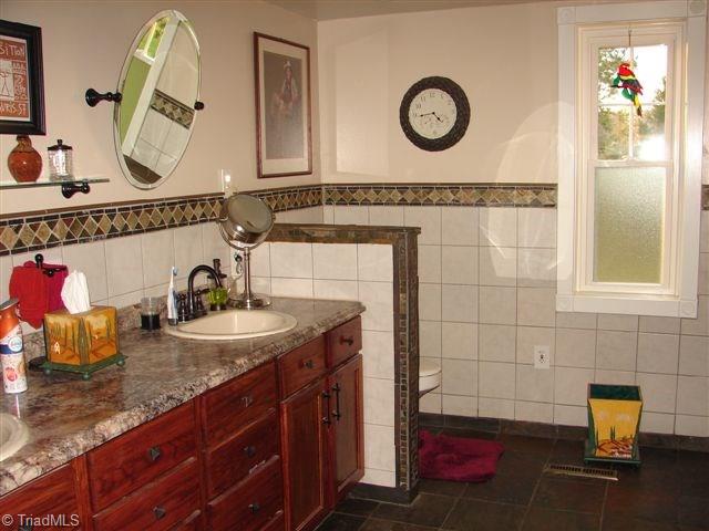 4904 Reeder Road Asheboro, NC 27205 - Photo 30 of 30 1st floor bath room with double sinks,walk-in tiled shower.