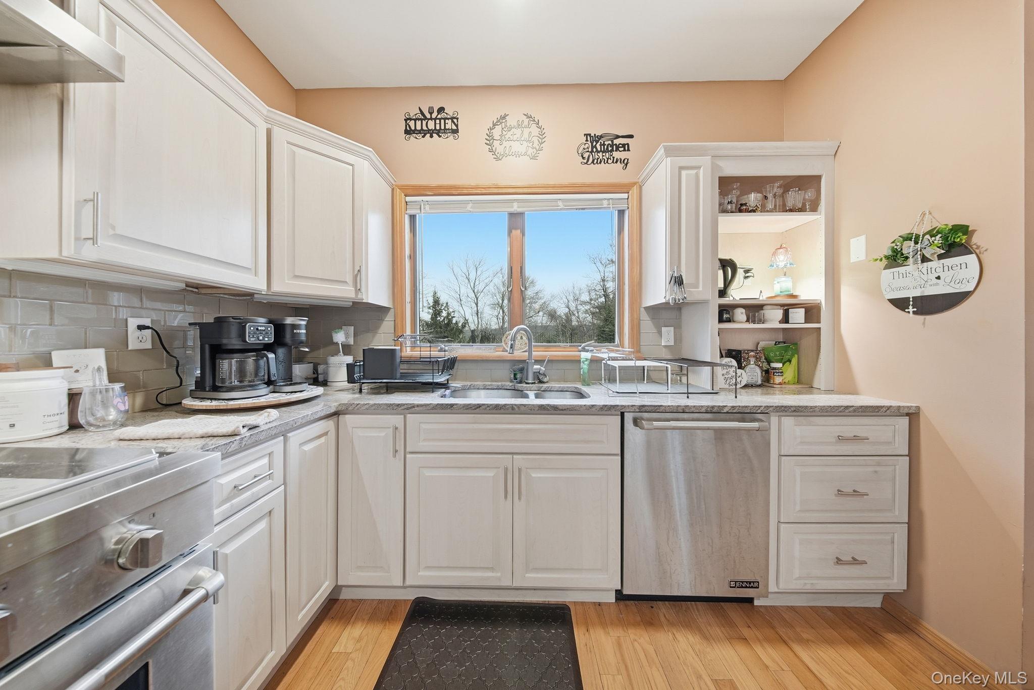 191 David Rhodes Road Wurtsboro, NY 12790 - Photo 11 of 39 a kitchen with stainless steel appliances granite countertop a sink and cabinets