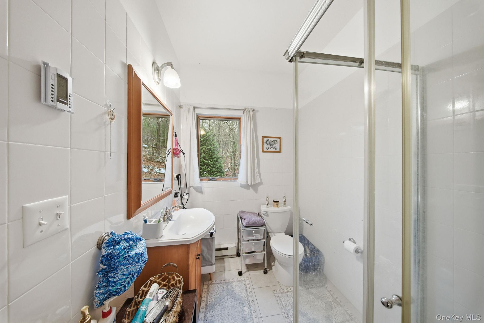 191 David Rhodes Road Wurtsboro, NY 12790 - Photo 13 of 39 a bathroom with a sink toilet and shower