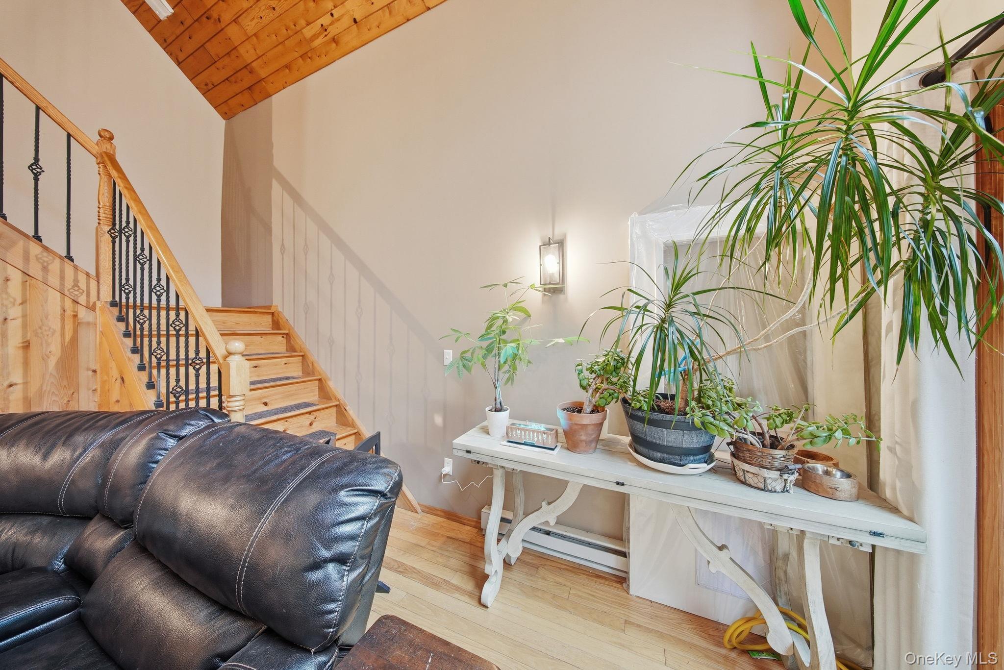 191 David Rhodes Road Wurtsboro, NY 12790 - Photo 18 of 39 a living room with furniture flowerpot and wooden floor