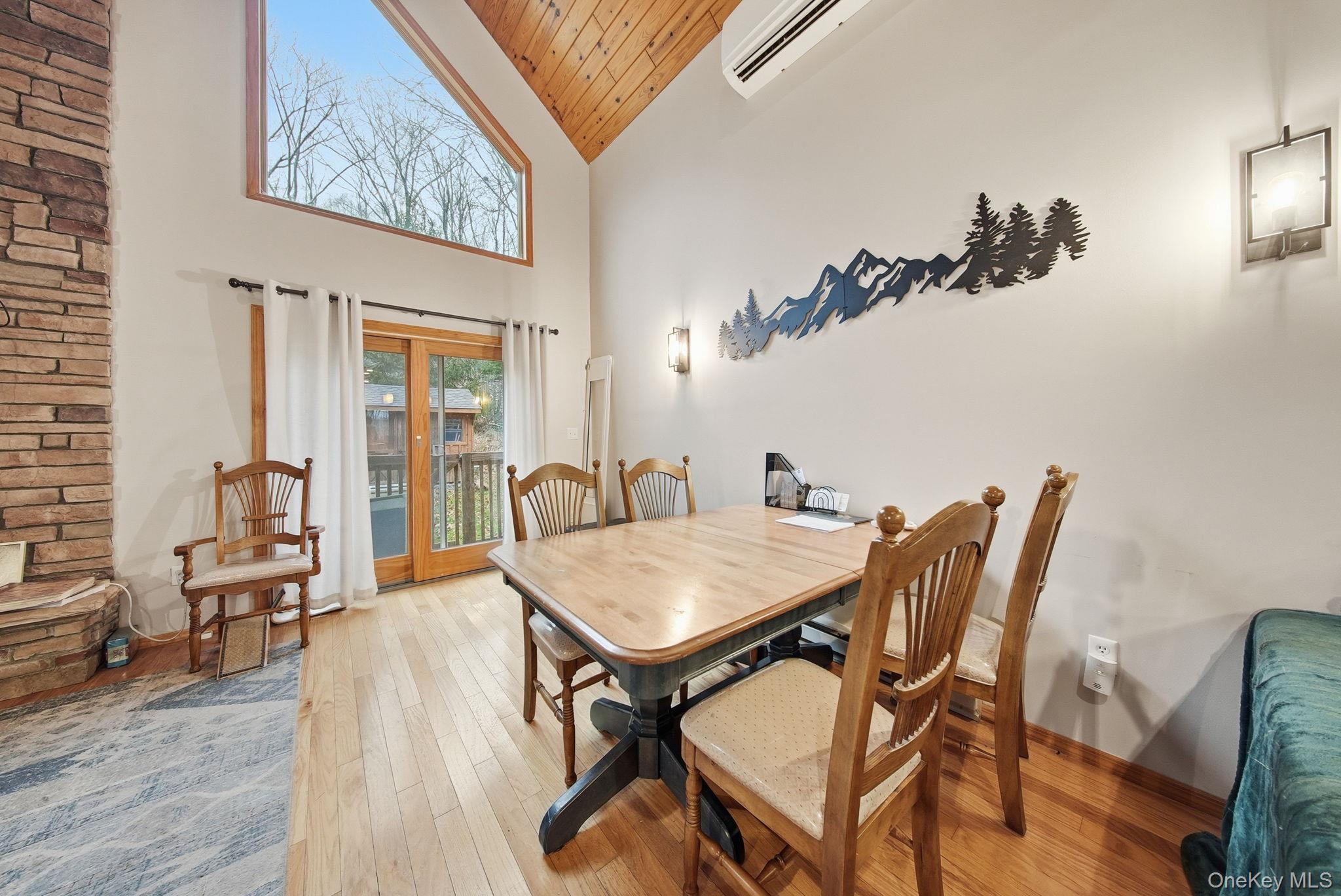 191 David Rhodes Road Wurtsboro, NY 12790 - Photo 25 of 39 a view of a dining room with furniture and wooden floor