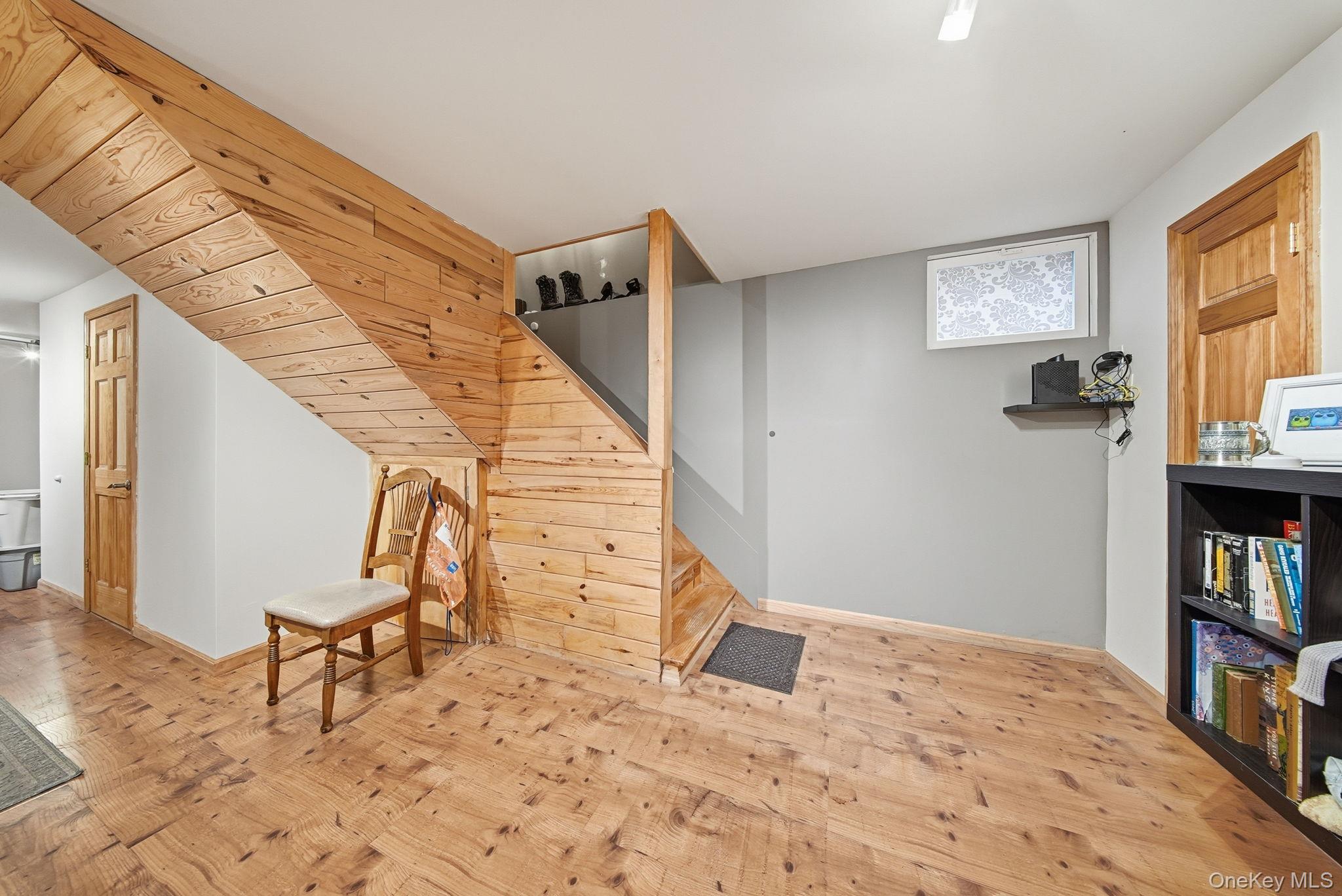 191 David Rhodes Road Wurtsboro, NY 12790 - Photo 26 of 39 a view of a bedroom with wooden floor and stairs