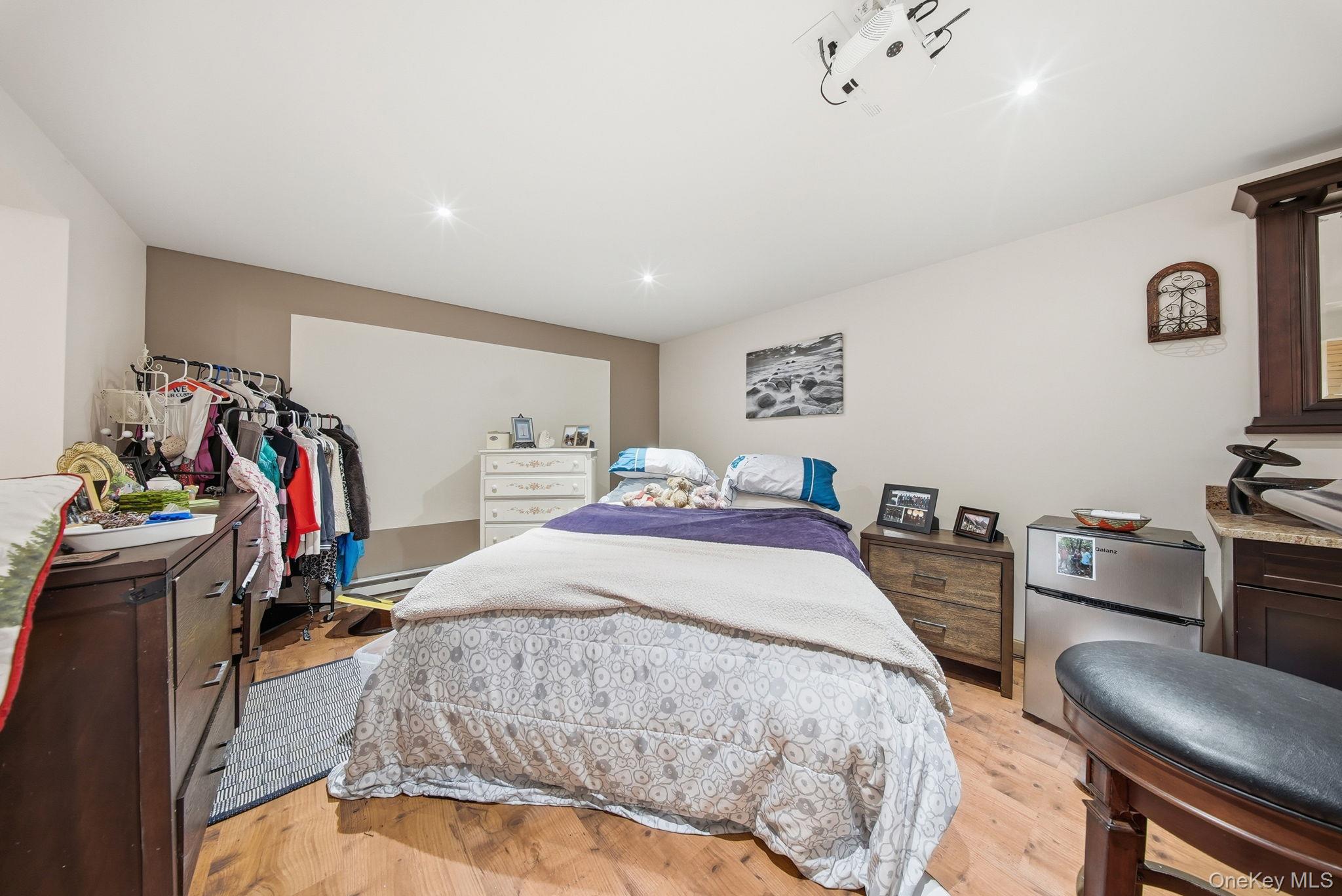 191 David Rhodes Road Wurtsboro, NY 12790 - Photo 28 of 39 a bed room with a bed mirror and a desk