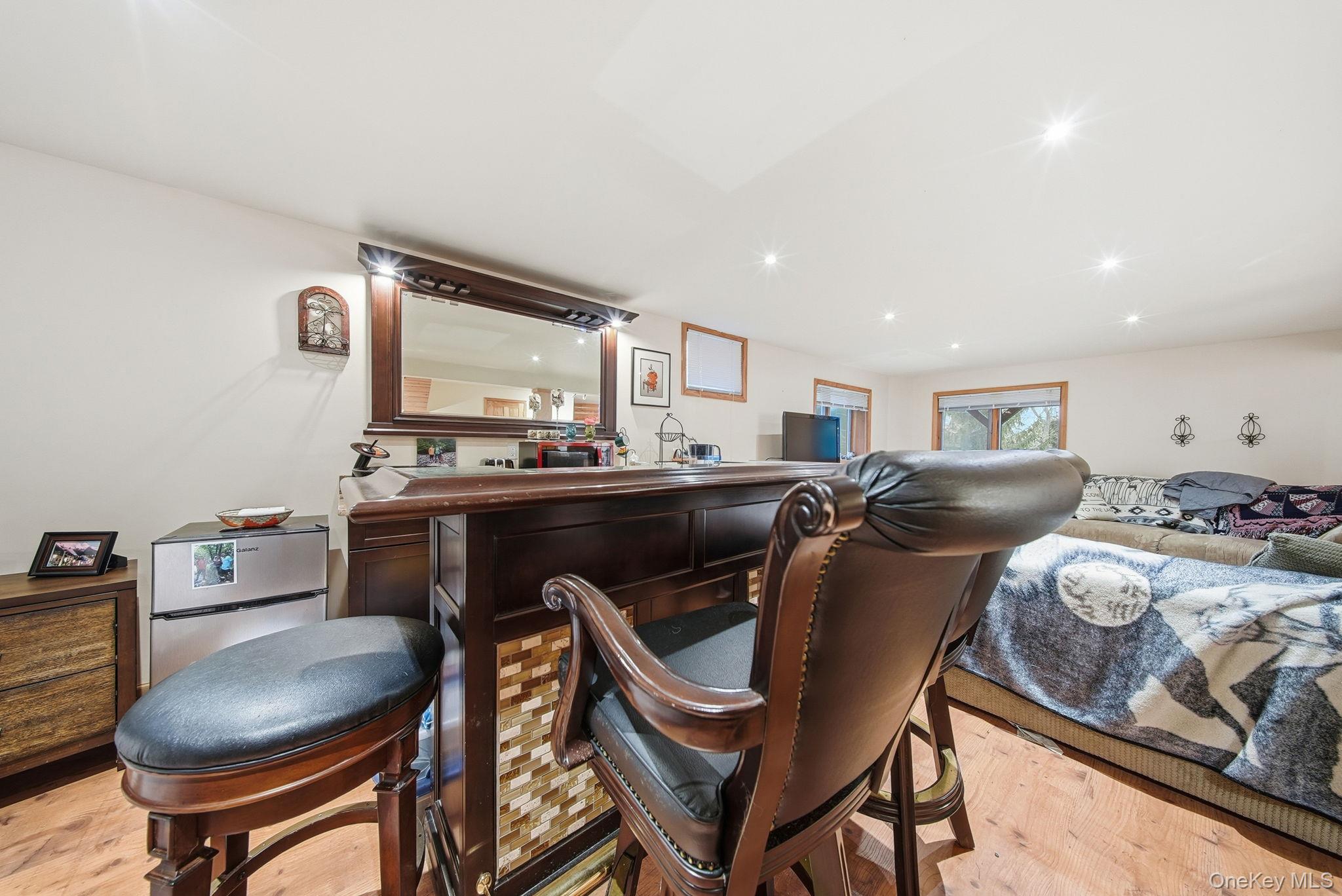 191 David Rhodes Road Wurtsboro, NY 12790 - Photo 29 of 39 a room with furniture a rug and a window