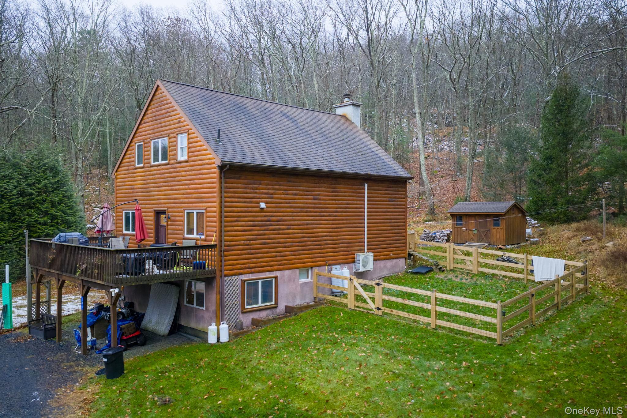 191 David Rhodes Road Wurtsboro, NY 12790 - Photo 3 of 39 a front view of a house with a yard table and chairs