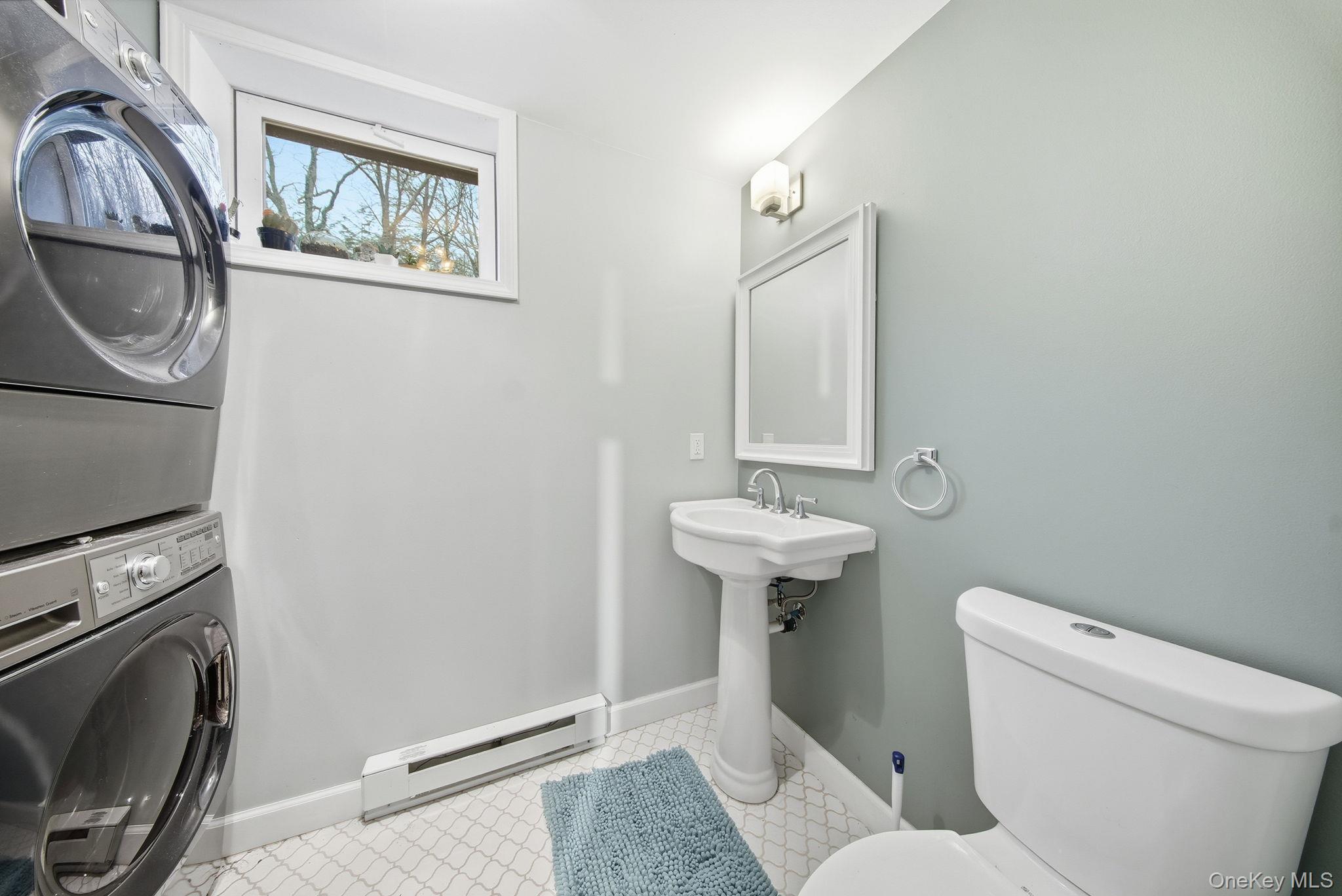 191 David Rhodes Road Wurtsboro, NY 12790 - Photo 31 of 39 a bathroom with a toilet a sink and a mirror