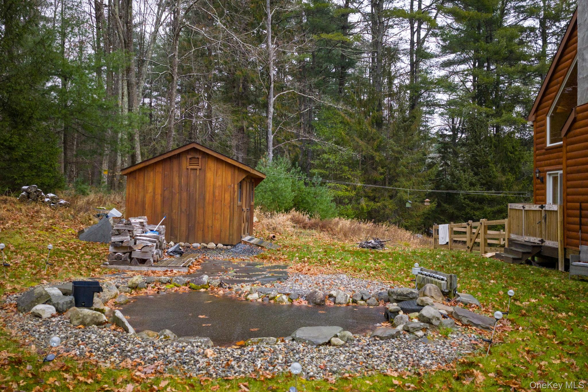 191 David Rhodes Road Wurtsboro, NY 12790 - Photo 39 of 39 a backyard of a house with yard and outdoor seating
